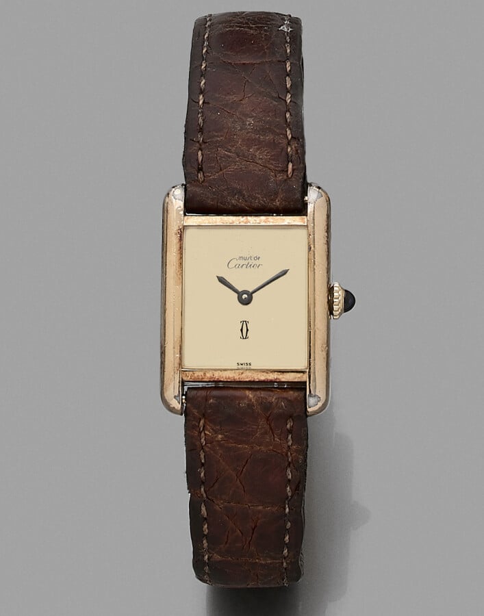 CARTIER - BRACELET MONTRE de dame modèle "Tank" en vermeil (925). Cadran jaune-…