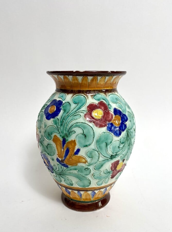 MONACO. Vase à anses torsadées à décor floral émaillé., deux vases à anses muni…