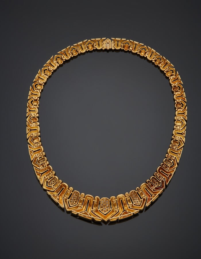 BOUCHERON - COLLIER articulé en or jaune (750) à motifs géométriques en chute,…