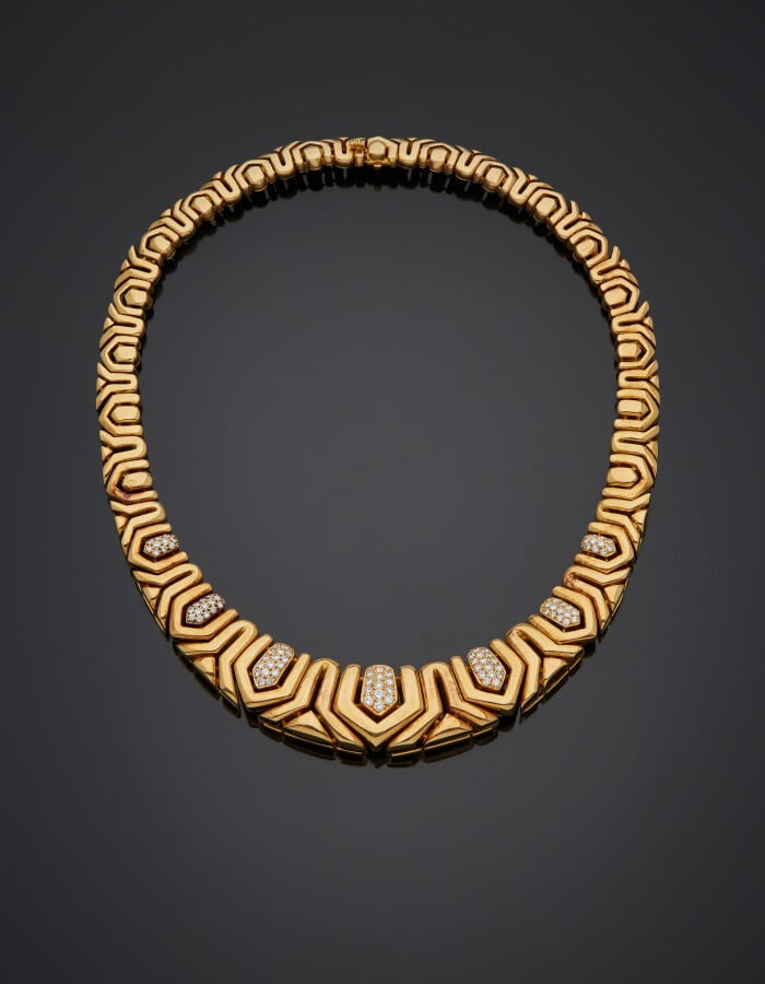 BOUCHERON - COLLIER articulé en or jaune (750) à motifs géométriques en chute,…