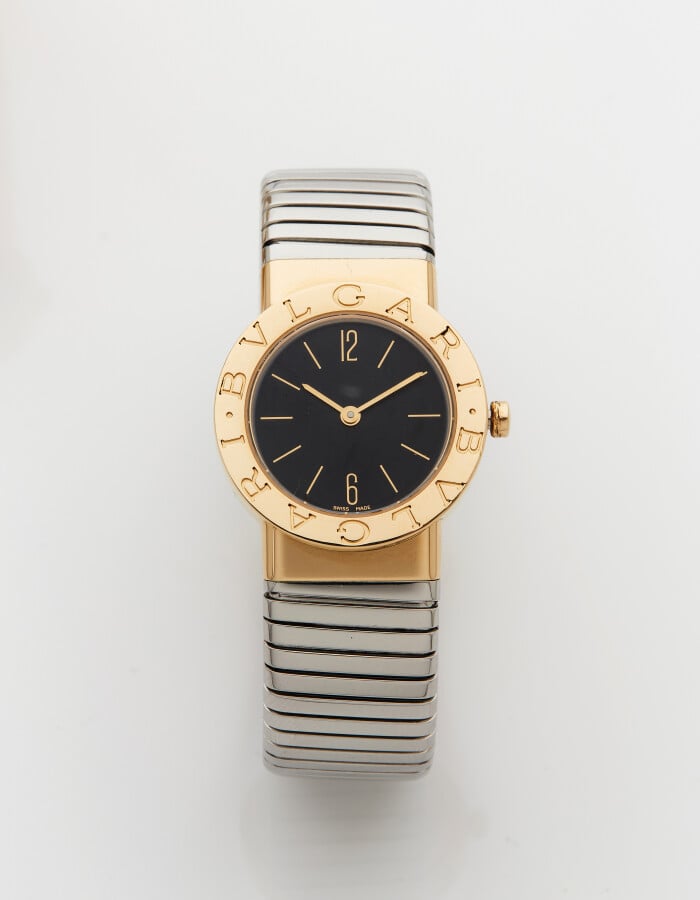 BULGARI - BRACELET MONTRE "Tubogaz" ronde en or jaune (750) et acier. Lunette g…