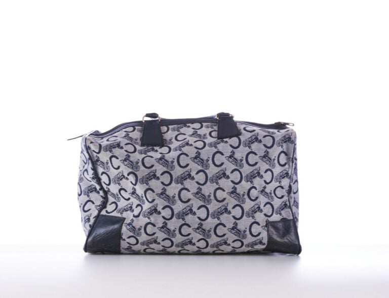 CELINE - 1970s/80s - SAC polochon en toile siglée et cuir marine - 40 x 22 x 16…