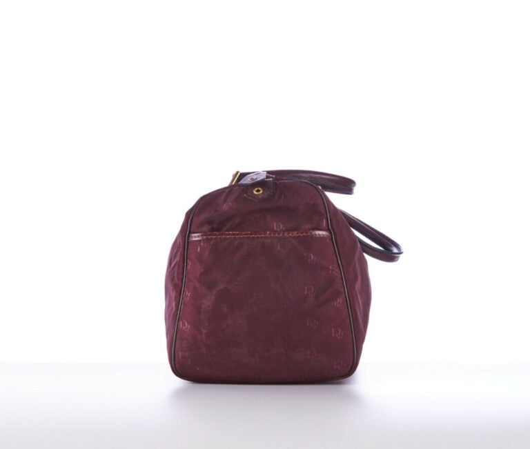 CHRISTIAN DIOR BAGAGES - 1980s/90s - SAC polochon en toile siglée et cuir borde…