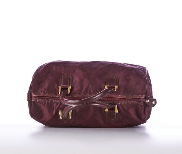 CHRISTIAN DIOR BAGAGES - 1980s/90s - SAC polochon en toile siglée et cuir borde…