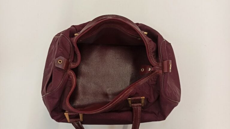 CHRISTIAN DIOR BAGAGES - 1980s/90s - SAC polochon en toile siglée et cuir borde…