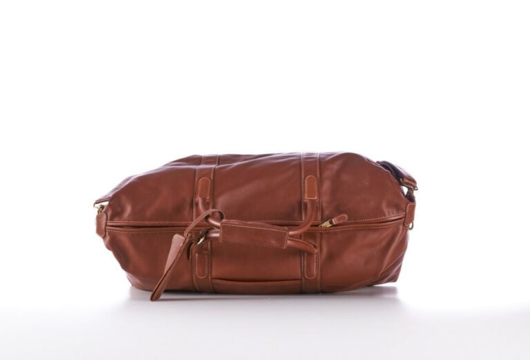 COACH - SAC DE VOYAGE en vache, garnitures en laiton doré, anse bandoulière amo…