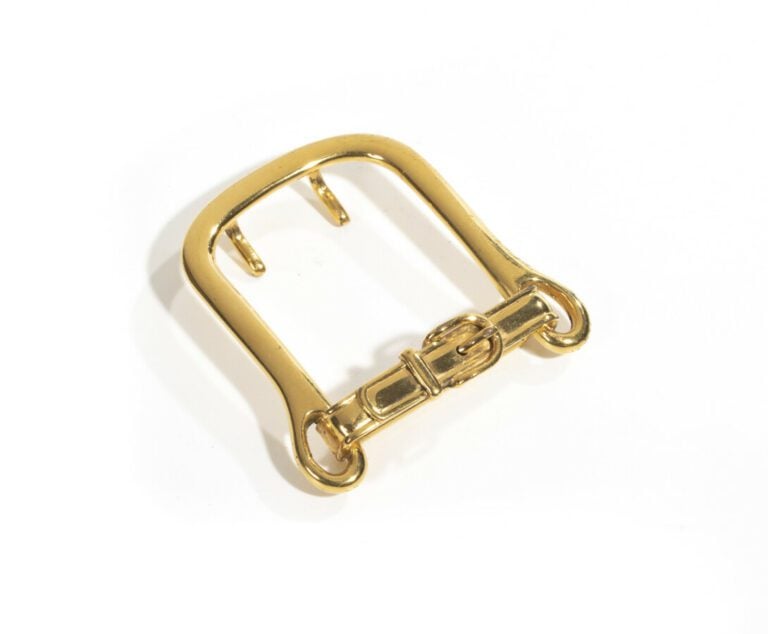 HERMES - - Boucle de ceinture en métal doré stylisant une petite boucle de cein…