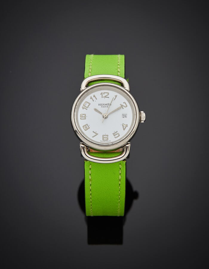 HERMES - BRACELET MONTRE « Pullman » ronde de dame, petit modèle, en acier, ajo…