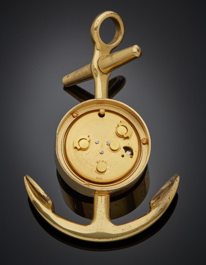 HERMES - MONTRE REVEIL de BUREAU "ancre marine" en métal doré. Cadran satiné. S…