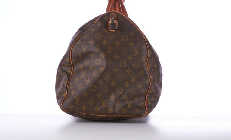 LOUIS VUITTON - SAC DE VOYAGE "Keepall 60" en toile Monogram et cuir naturel, g…
