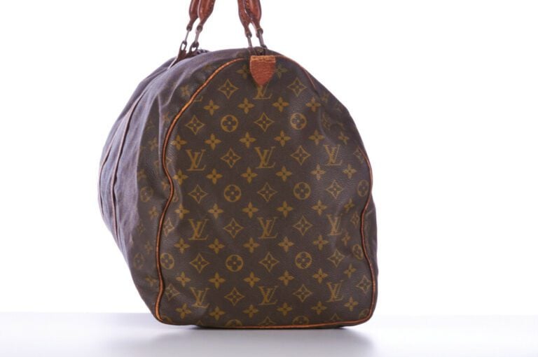 LOUIS VUITTON - SAC DE VOYAGE "Keepall 60" en toile Monogram et cuir naturel, g…
