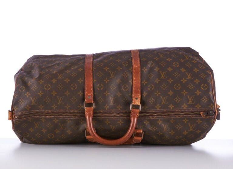 LOUIS VUITTON - SAC DE VOYAGE "Keepall 60" en toile Monogram et cuir naturel, g…