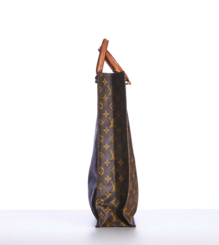 LOUIS VUITTON - SAC "Plat" en toile Monogram et cuir naturel, garnitures en lai…