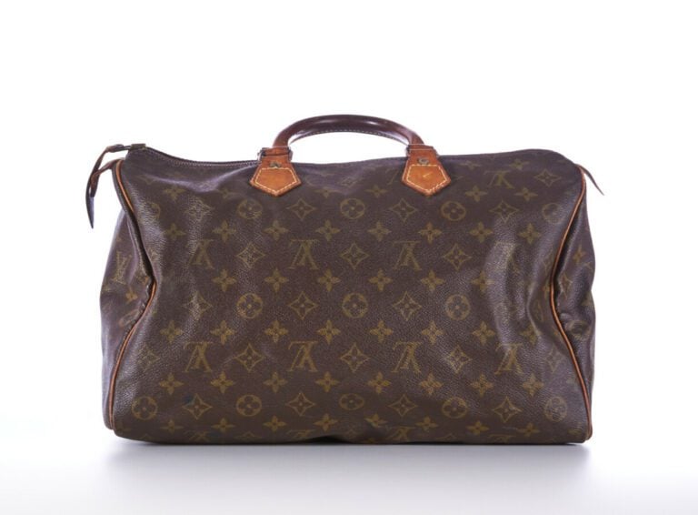 LOUIS VUITTON - SAC "Speedy" en toile Monogram et cuir naturel, garnitures en l…
