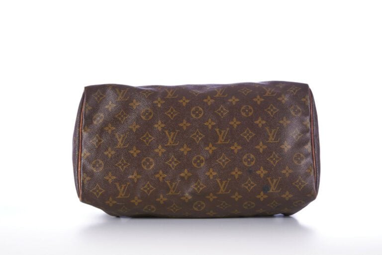 LOUIS VUITTON - SAC "Speedy" en toile Monogram et cuir naturel, garnitures en l…