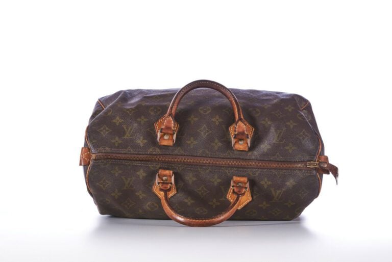 LOUIS VUITTON - SAC "Speedy" en toile Monogram et cuir naturel, garnitures en l…