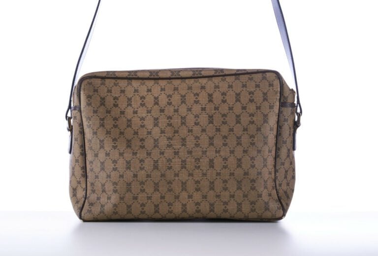 NINA RICCI - BESACE en toile enduite siglée et cuir chocolat - 32 x 22 x 10 cm…