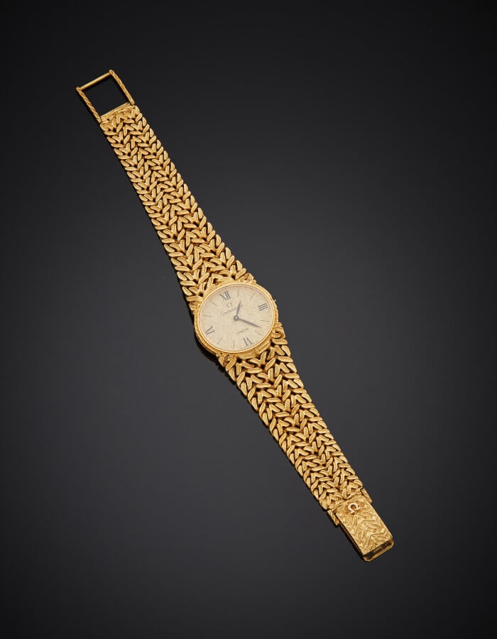 OMEGA - BRACELET MONTRE ovale de dame, modèle "Constellation", en or jaune (750…