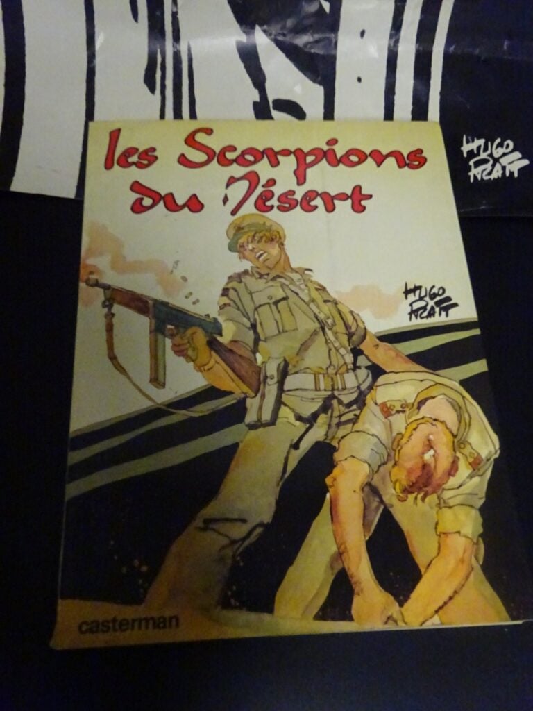 Album, Les Scorpions du Désert, et un poster d'Hugo Pratt dédicacée (état moyen…