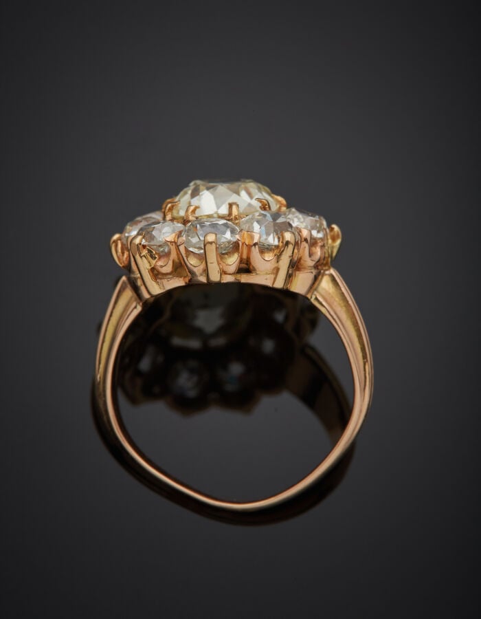 BAGUE "marguerite" en or rose (585 millièmes) 14 carats, serti d'un diamant tai…