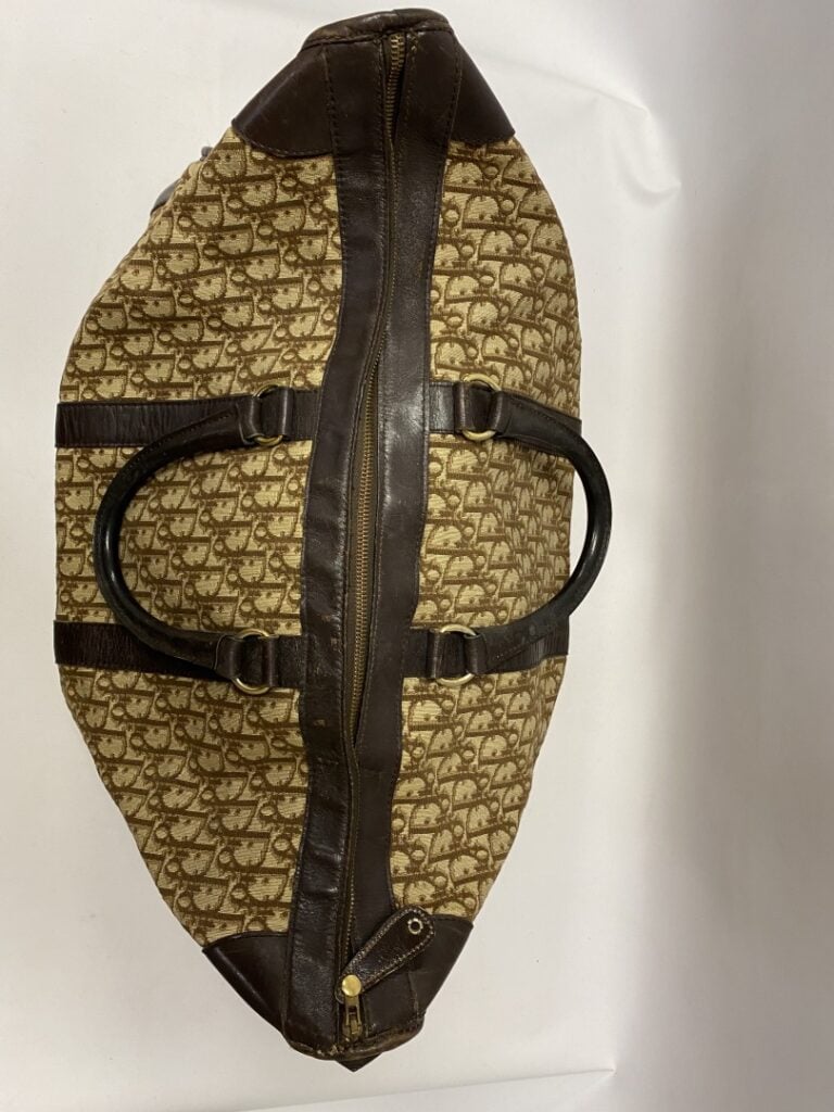Christian Dior sac de voyage vintage grand modèle en toile monogrammée et cuir…