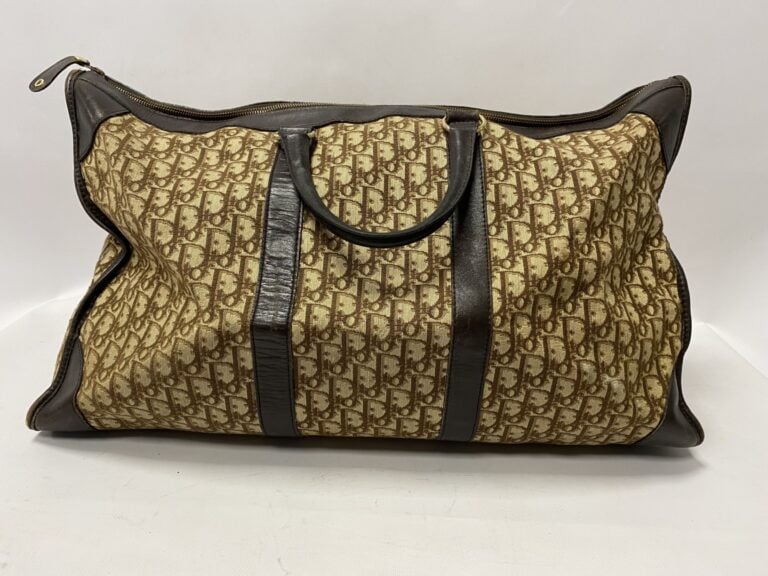 Christian Dior sac de voyage vintage grand modèle en toile monogrammée et cuir…
