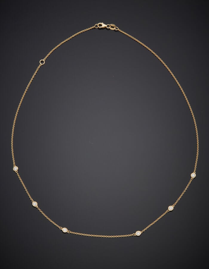 COLLIER chaînette en or jaune (585‰) 14 carats, retenant six diamants taille br…