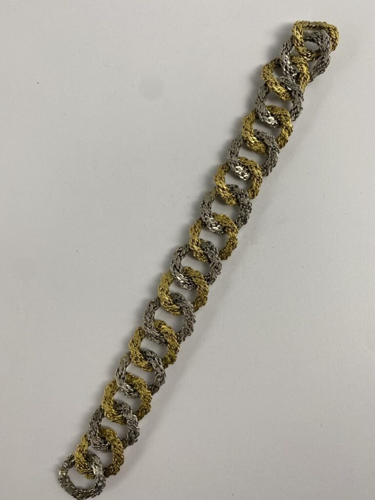 Dans le goût de Georges LENFANT - Bracelet ruban articulé en or (750) deux tons…