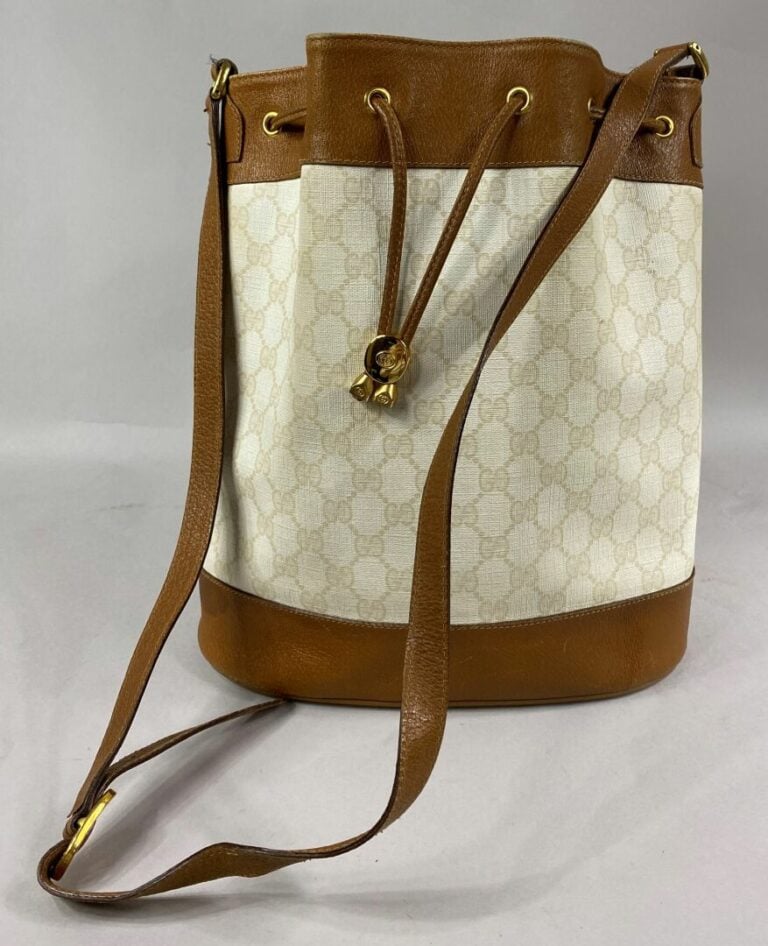 GUCCI - Sac bourse en toile monogrammée beige et cuir naturel, fermeture par li…