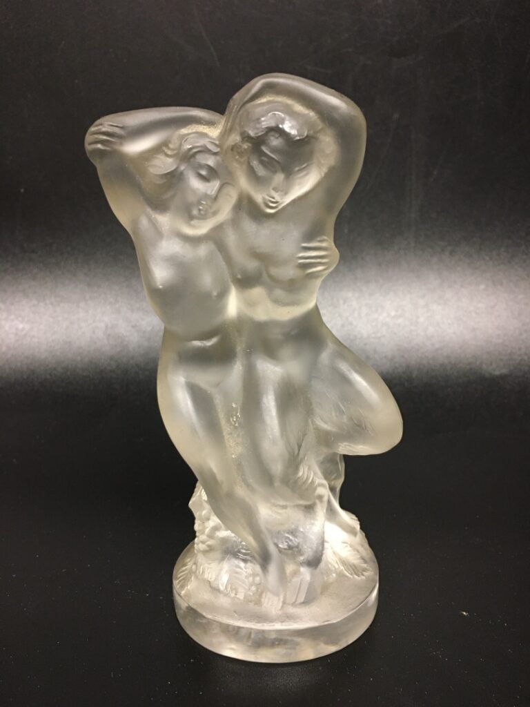 LALIQUE FRANCE. - Faune et Leda - Deux sujets en verre pressé moulé, signés au-…