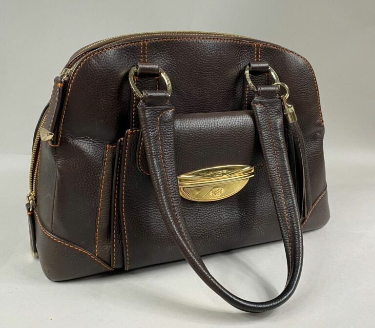 LANCEL - Sac Adjani en cuir grainé chocolat et surpiqûres oranges, à double poi…