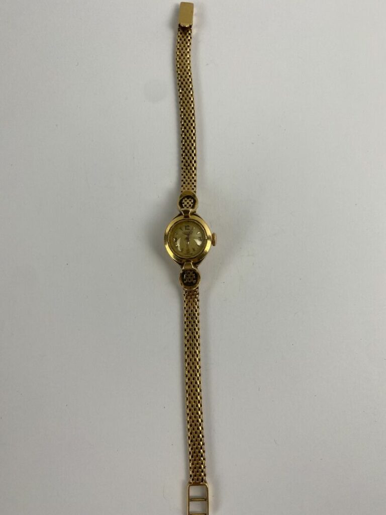 LONGINES - Montre bracelet de dame en or jaune (750), boîtier rond - Cadran à f…
