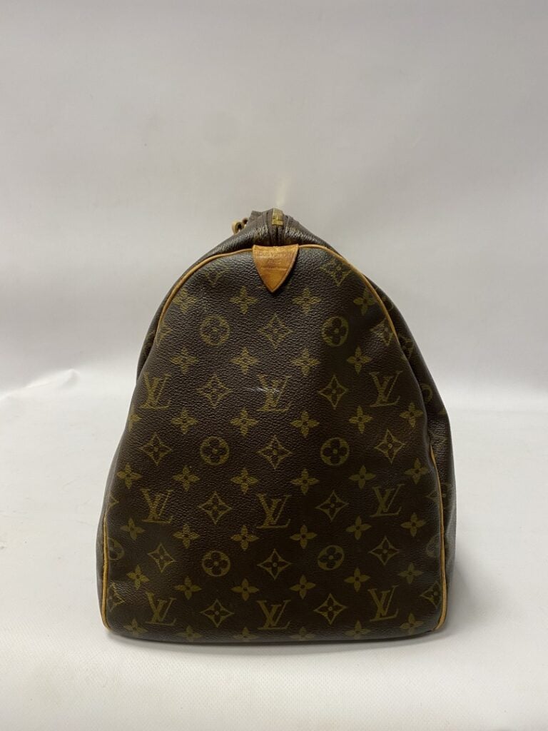 LOUIS VUITTON sac modèle Keepall 55cm. - Toile monogrammée, porte étiquette en…