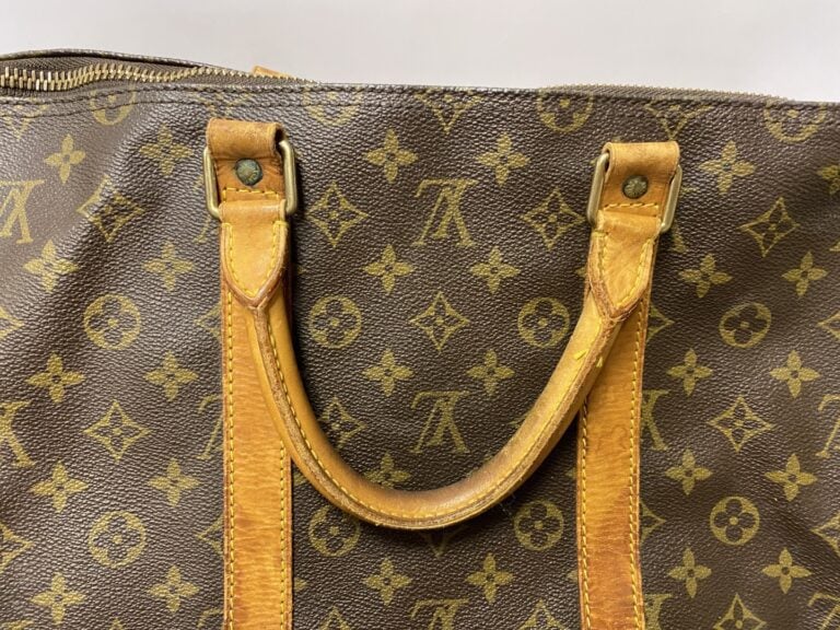 LOUIS VUITTON sac modèle Keepall 55cm. - Toile monogrammée, porte étiquette en…
