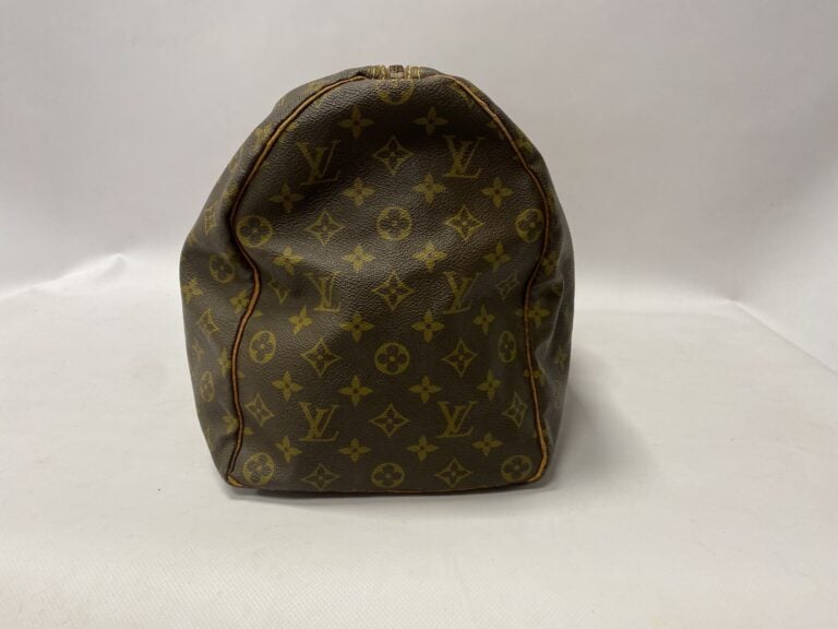 LOUIS VUITTON un sac modèle Keepall 45cm - Toile monogrammée avec accessoires e…