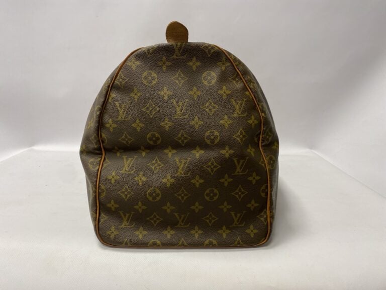 LOUIS VUITTON un sac modèle Keepall 55cm - Toile monogrammée avec accessoires e…