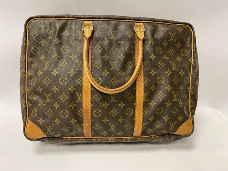 LOUIS VUITTON une valise souple modèle Sirius 45cm. - Toile monogrammée, cadena…