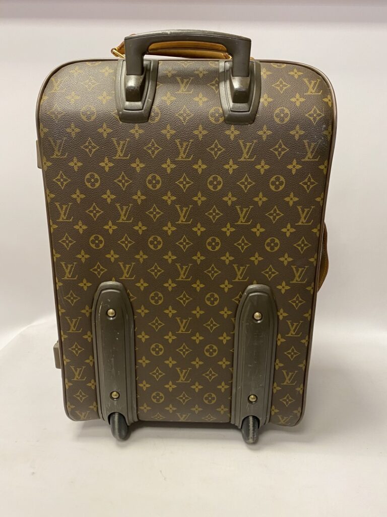 LOUIS VUITTON valise cabine Pégase légère à roulettes, 55cm. - Une poche plaqué…