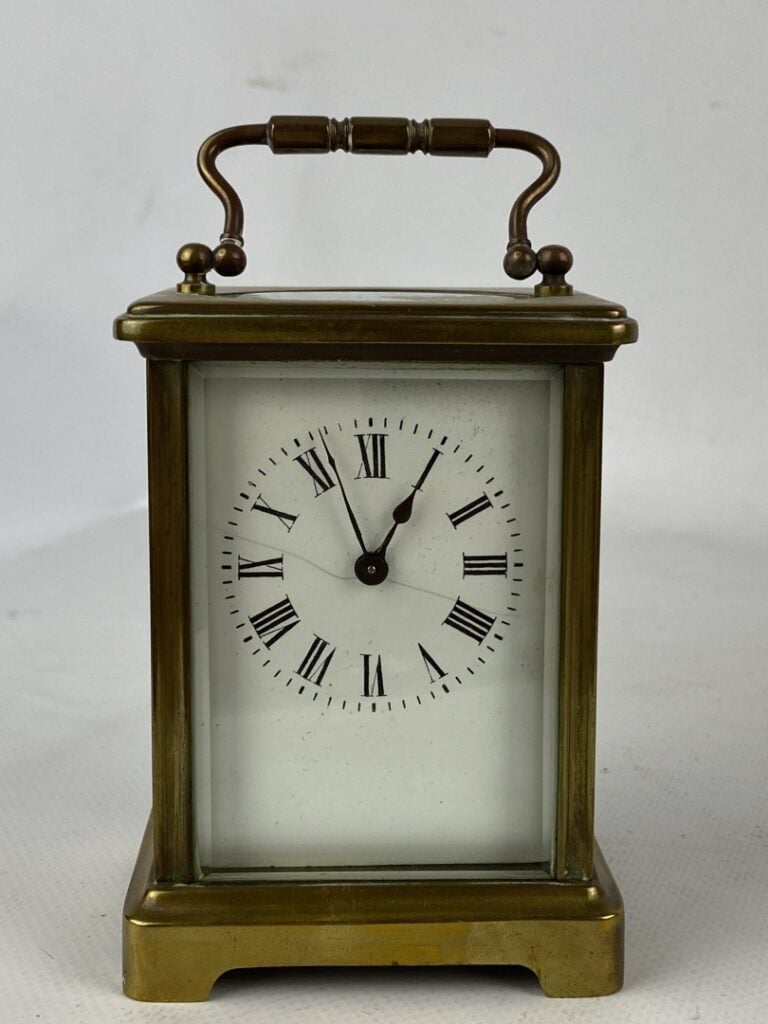 Pendulette d'officier à monture cage en bronze et métal doré - Le cadran émaill…