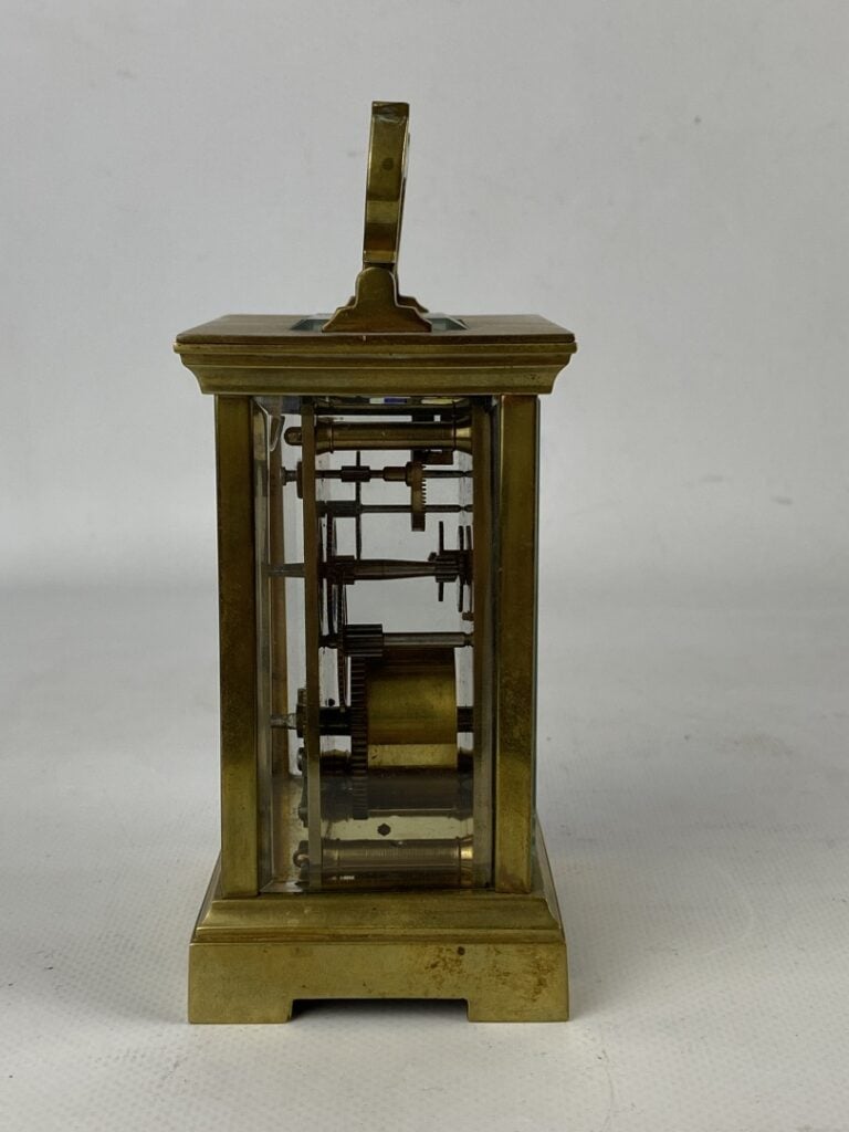 Pendulette d'officier à monture cage en laiton et métal doré - Le cadran émaill…