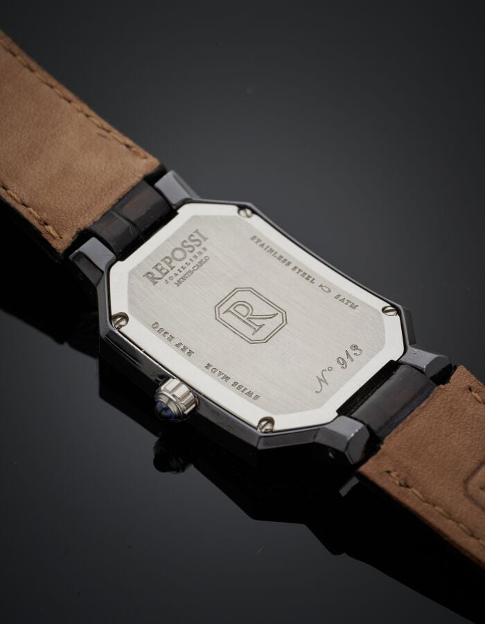 REPOSSI - BRACELET MONTRE octogonale de dame en acier et acier noirci. Lunette…