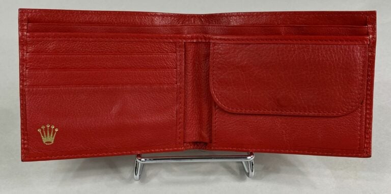 ROLEX - Portefeuille en cuir rouge - Numéroté - 9 x 11.5 cm - (très bon état)…