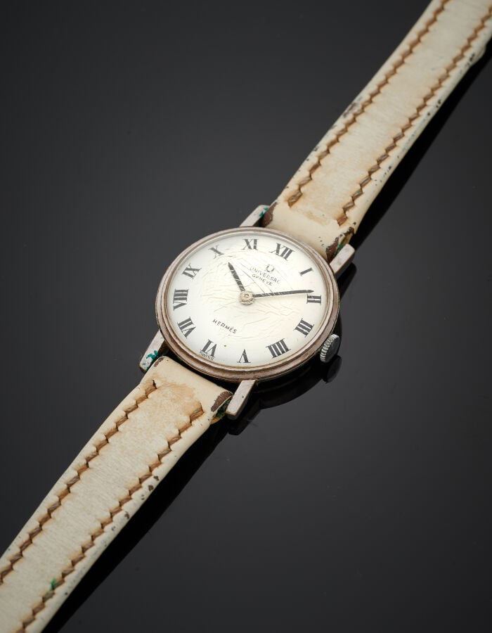 UNIVERSAL pour HERMES - BRACELET MONTRE ronde de dame en acier. Cadran blanc, c…