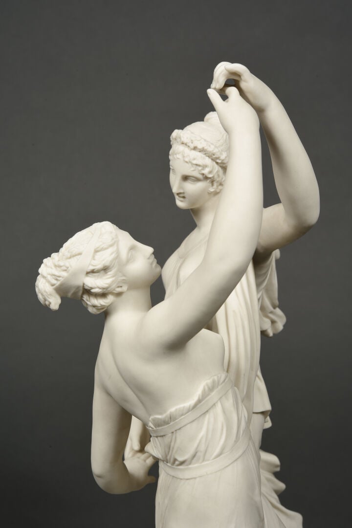 SEVRES - Grand groupe de "La Danse" sur socle circulaire à décor émaillé blanc,…