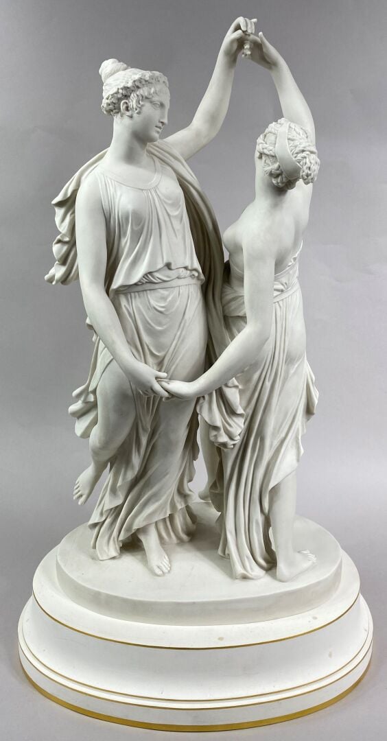 SEVRES - Grand groupe de "La Danse" sur socle circulaire à décor émaillé blanc,…