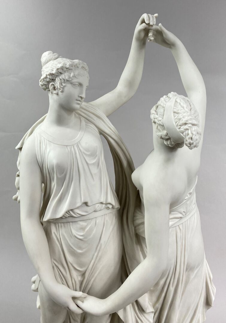 SEVRES - Grand groupe de "La Danse" sur socle circulaire à décor émaillé blanc,…