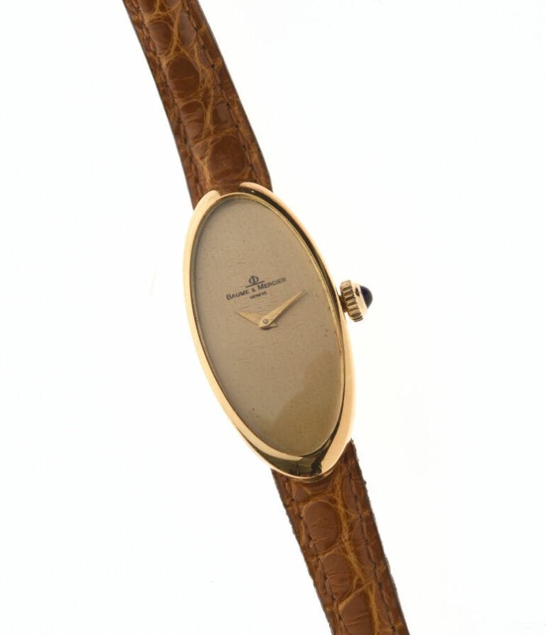 Baume et Mercier et O.J. Perrin-Paris. Montre bracelet de dame en or jaune 18 c…