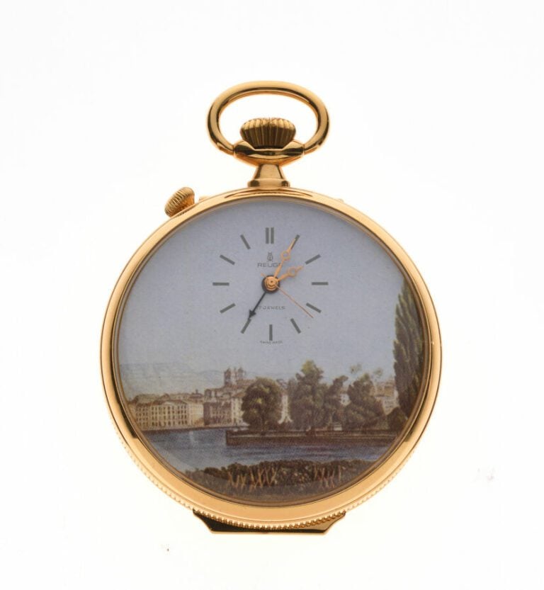 Reuge.Importante montre et boite à musique plaqué or à décor imprimé de paysage…
