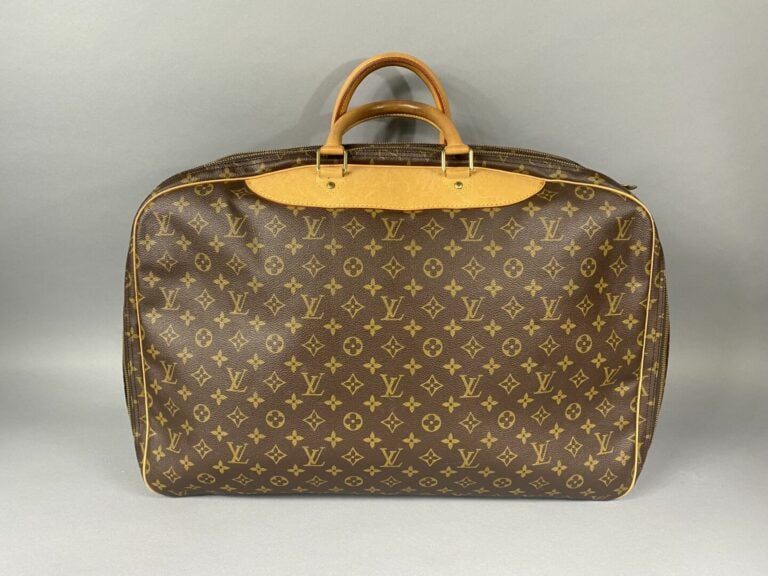 Louis VUITTON - Sac de voyage "Alizé" 55 cm en toile enduite monogram, deux com…