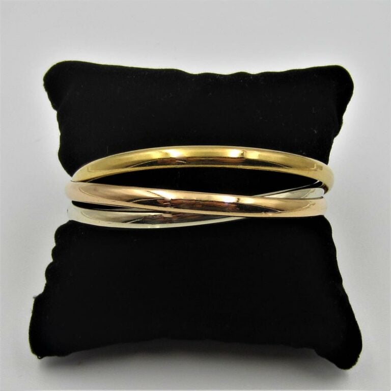 BRACELET rigide trois anneaux trois ors (750 millièmes). - Long. : 20 cm enviro…